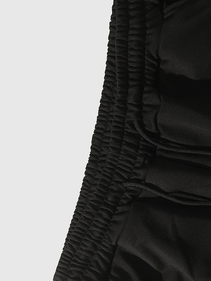 Men’s Black Flared Pants – Cross Print Streetwear Trousers with Red Stripe