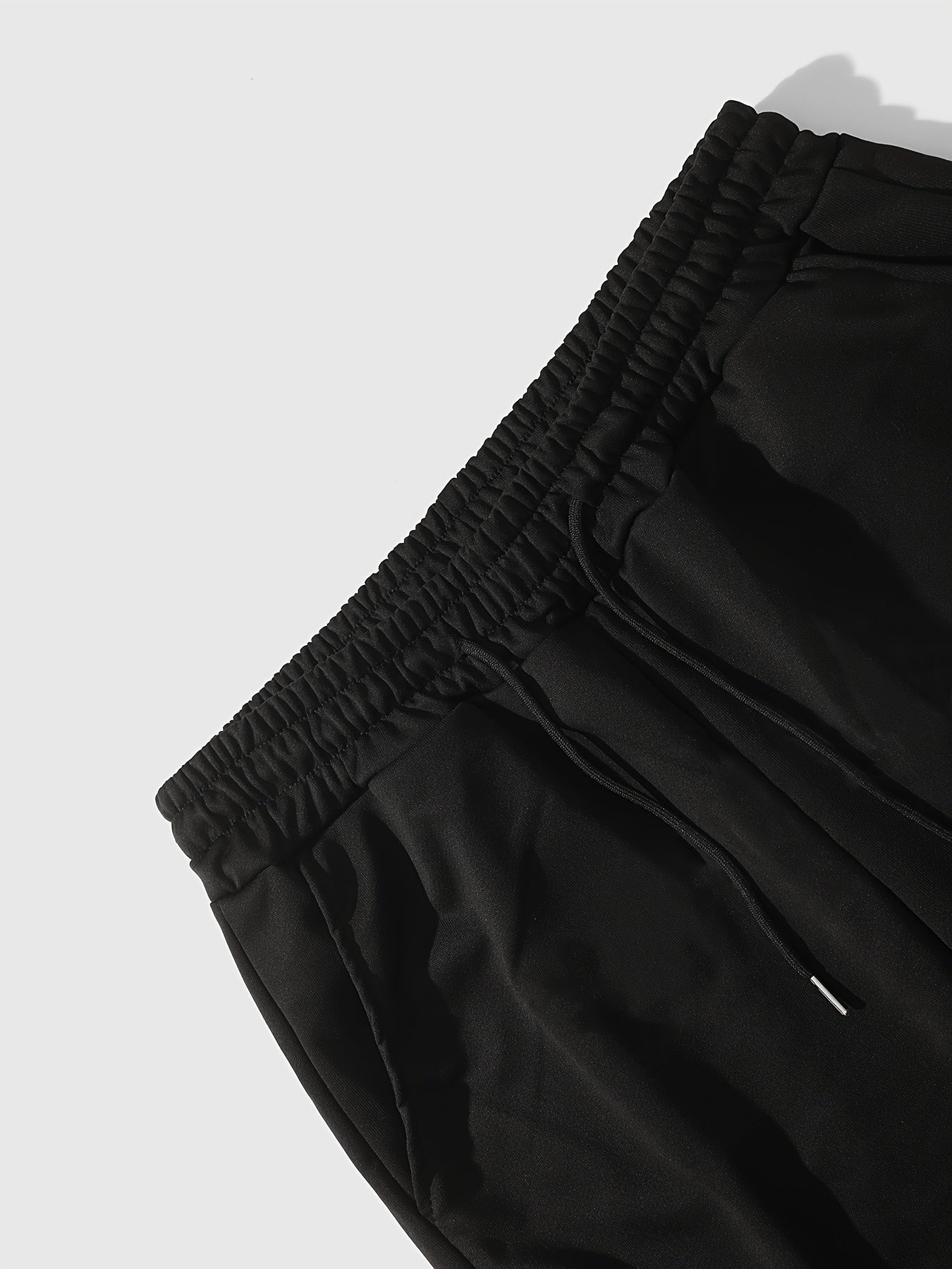 Men’s Black Flared Pants – Cross Print Streetwear Trousers with Red Stripe