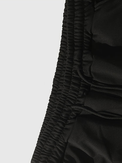 Men’s Black Flared Pants – Cross Print Streetwear Trousers with Red Stripe